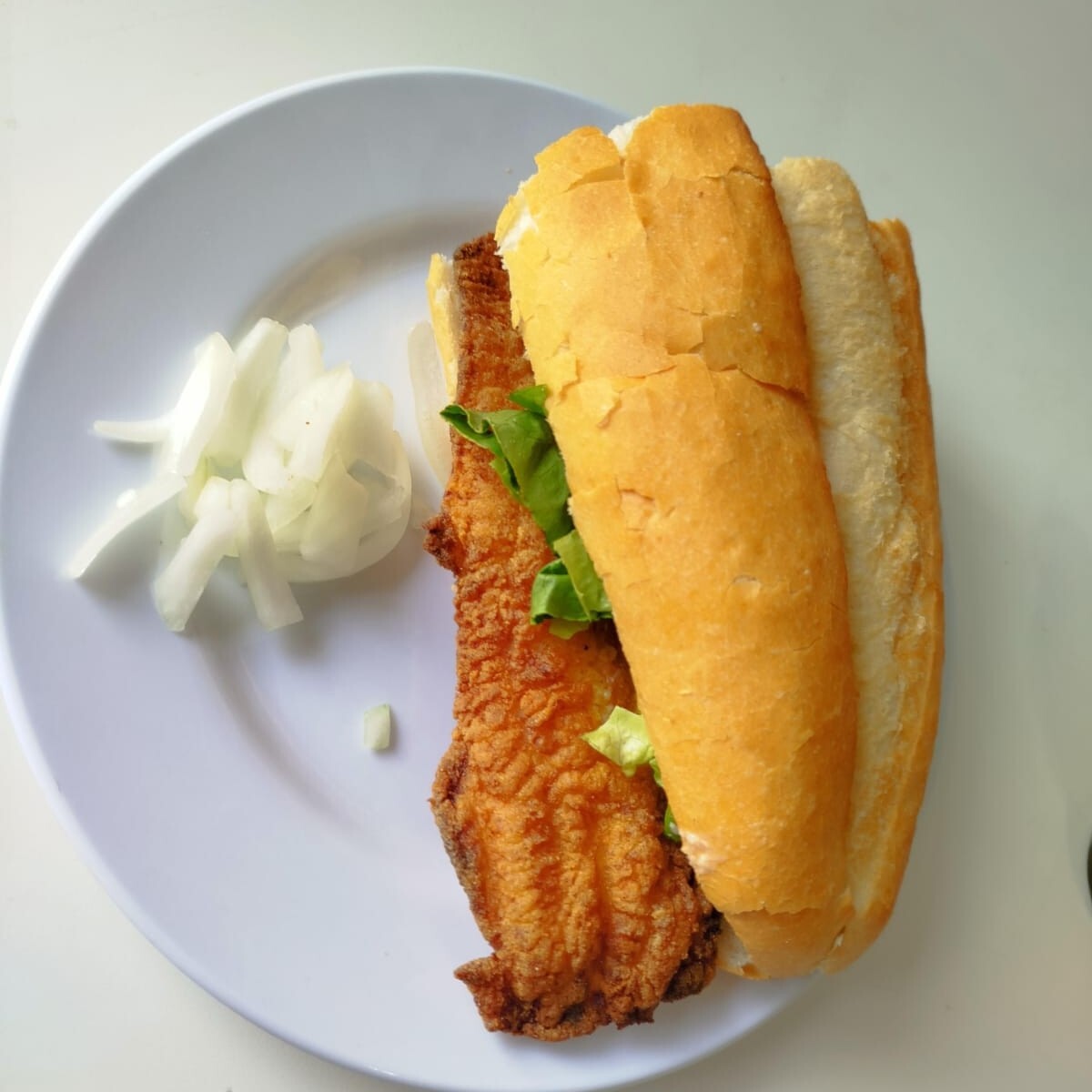 Yarım Ekmek Mezgit 250 Gr balığın pişmiş i var