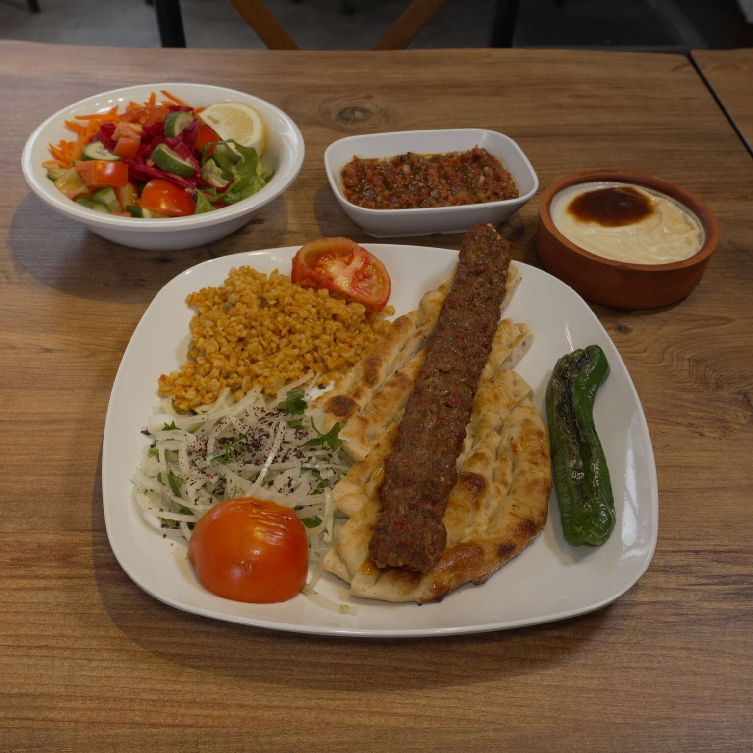 Adana Kebap + Güveçte Hamsiköy Sütlaç (200 gr)